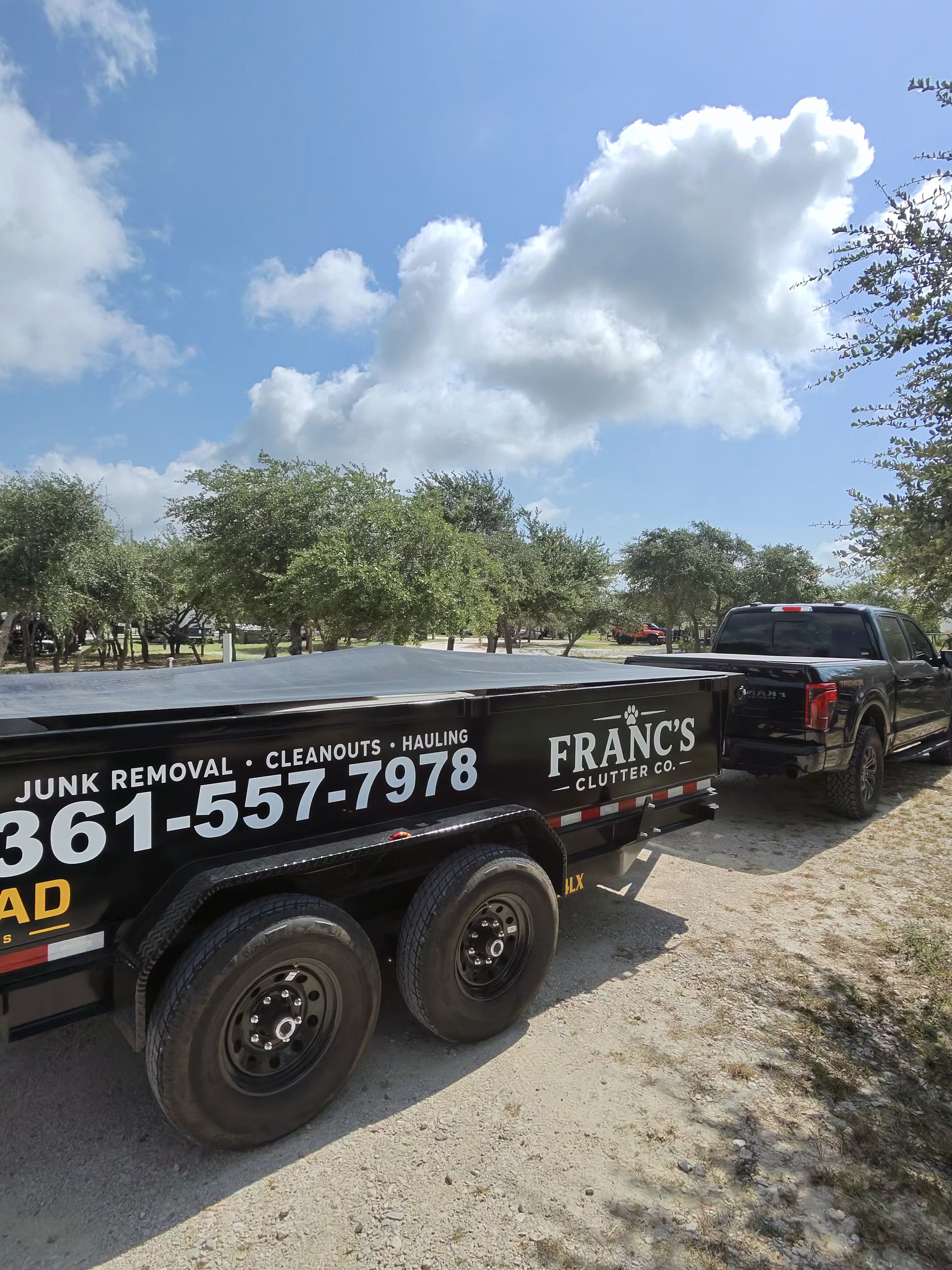 Franc's Clutter Co branded dump trailer and truck ready for junk removal and hauling